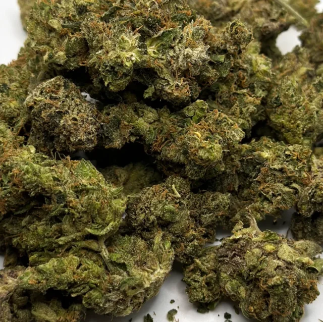 Mr. Pink is a potent sativa-dominant hybrid strain (80% sativa/20% indica) that is a cross of Pink Lady and Purple Kush. This strain has a moderate THC level of 15-19%, and it provides an immediate head high that is accompanied by a mellow body buzz. It can help reduce chronic stress, anxiety, pain and mild depression. It has a sweet, cheese-like aroma with a flavor that is reminiscent of brown sugar and cheese. It has neon green nugs that are covered in rich amber hairs and crystal white trichomes.